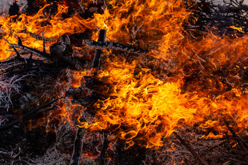 Flaming fire. Burning tree branches. Pagan rite dedicated to the arrival of spring. Big bonfire on Shrovetide. Auto-da-fe, ritual of public punishment, burning at the stake.
