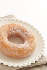 Sugar soy donut on white dish for  dessert image
