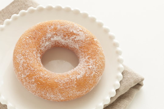 Sugar soy donut on white dish for  dessert image