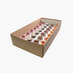 Collection of take away kraft boxes with  different desserts on white background, top view.