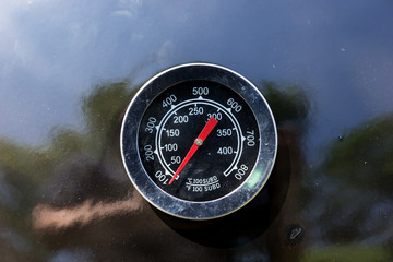Close-up of the thermometer on the new grill shows the temperature