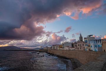 Sunset/Dusk along the sea front of Alghero (L'Alguer), province of Sassari , Sardinia, Italy. ...