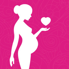 Silhouette of pregnant woman with floral ornament and heart