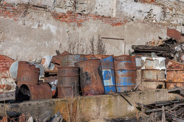 Group of old, rusty barrels with toxic chemical  waste