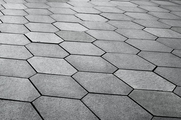 Texture of gray hexagonal paving slabs