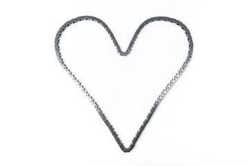 heart made of car engine chain on a white background. heart of timing chain of gas distribution mechanism