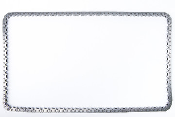 square by car engine chain on a white background with copy space. frame of timing chain of gas distribution mechanism 