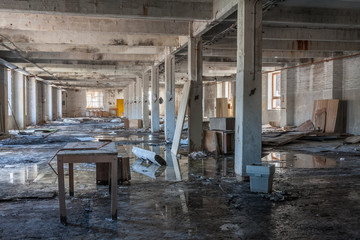 Hall in abandoned textile factory that is bankrupt and demolished.