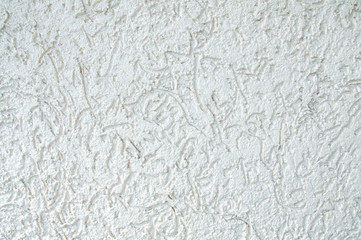 plastered light wall. White - yellow background. Bark beetle Texture