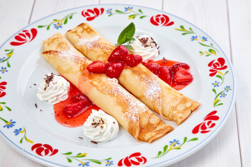 crepes with strawberry sauce and whipped cream