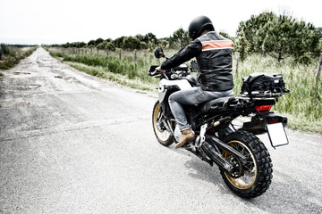 Fototapeta na wymiar Motorcycle driver ready for motocross road
