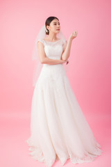 Beautiful asian bride portrait in pink studio