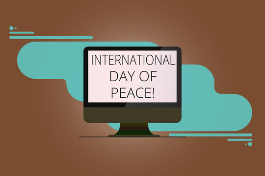 Writing note showing International Day Of Peace. Business photo showcasing Worldwide peaceful celebration Hope freedom Mounted Computer Monitor Blank Reflected Screen on Abstract Background