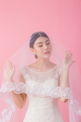 Beautiful asian bride portrait in pink studio - 270768555