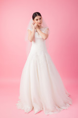 Beautiful asian bride portrait in pink studio - 270768732