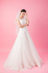 Beautiful asian bride portrait in pink studio - 270768753