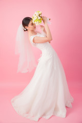 Beautiful asian bride portrait in pink studio - 270768758