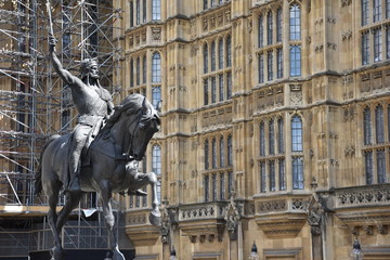 Statue of King Richard I or Richard the Lionheart outside the Houses of Parliament Westminster London England. King of England from 6 July 1189 until his death. - obrazy, fototapety, plakaty
