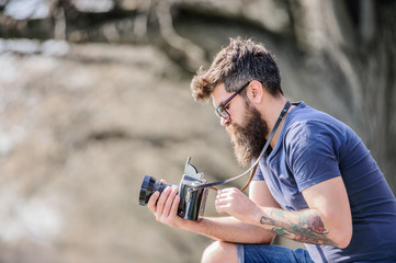 outdoor photographic equipment. hipster man in sunglasses. brutal photographer with camera. Mature...