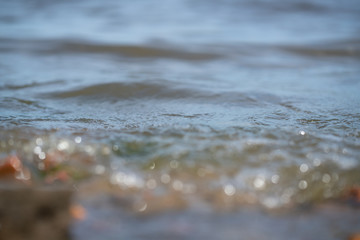 Photo of waves on the water, with a soft blur of bokeh in a non-zone of sharpness. background