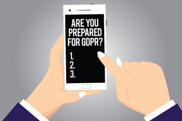 Handwriting text writing Are You Prepared For Gdprquestion. Concept meaning General data protection regulation Hu analysis Hands Holding Pointing Touching Smartphone Blank Color Screen