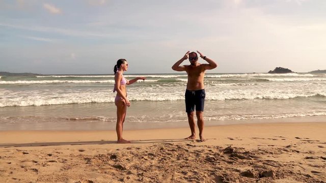 Young couple fighting on beach, slow motion shot at 240fps 