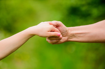 Giving all support to kid. Helpful hand of father. Upbringing and child development. Kindness and support. Trustful relations. Family bonds. Support your kid. Friendship and friendly relationships