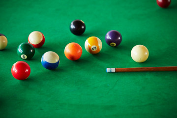 Billiards balls on green table 