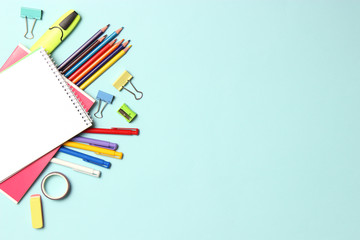School office on a colored background top view. Office office, student office. Concept back to school. place for text. Flatlay