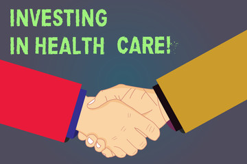 Handwriting text Investing In Health Care. Concept meaning Make investments in wellbeing medical insurance Hu analysis Shaking Hands on Agreement Greeting Gesture Sign of Respect photo