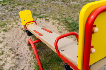 Empty wooden colorful seesaw board on playground. - 270773911