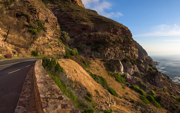 Rocky cliffs on the coastline of the Atlantic Ocean near Cape Town on Chapman’s Peak Drive, South Africa