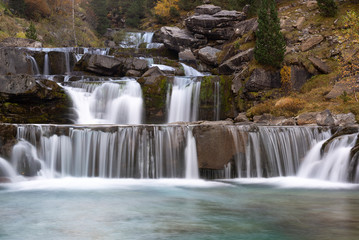 Fototapeta na wymiar Gradas De Soaso, Falls on Arazas River, Ordesa and Monte Perdido National Park, Huesca, Spain