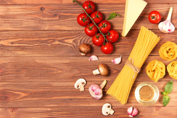 set of products for cooking Italian pasta top view, place for text