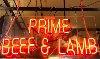 Prime beef and lamb neon sign in a butcher shop window