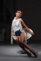 Naklejka premium Perfect lady posing sitting on a chair.