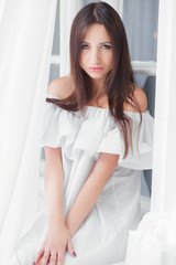 Portrait beautiful woman dressed in white dress.