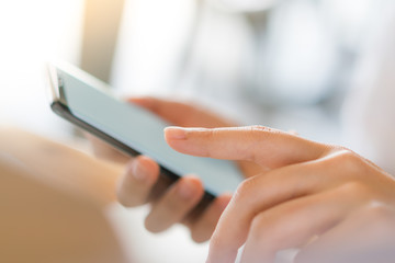 Business hand with mobile phone .