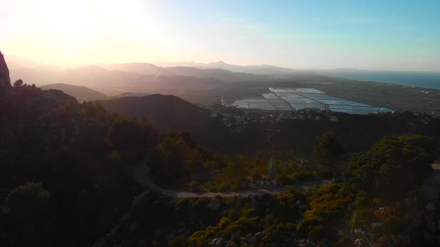 Aerial drone view of telecommunication antennas at sunset, in Segaria mountain, in Marina Alta, Alicante, Spain