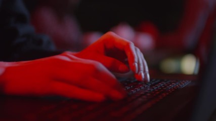 Close up of female fingers typing on computer keyboard