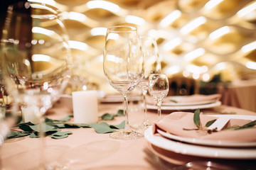 Table setting for a wedding ceremony at swimming pool. round table with white tablecloth