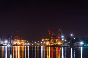 SEAPORT AT NIGHT - Port quays and transhipment terminals in colored lights