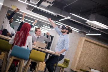 Fototapeta na wymiar Young Multiethnic Business team using virtual reality headset