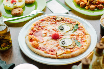 Funny face pizza for kids in a restaurant.