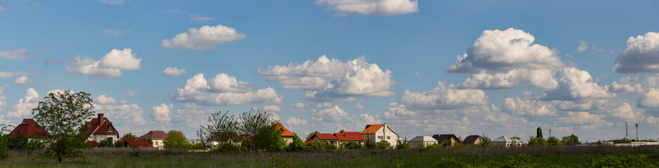Fototapeta na wymiar Outskirts of Chisinau. Panorama with the capital of Moldova. Cloudy sky before the rain.