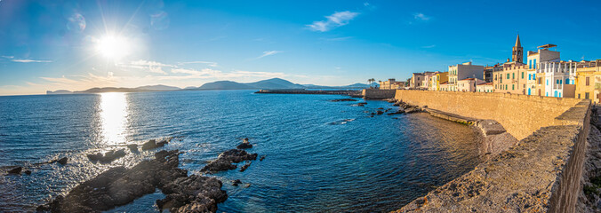 Gorgeous sea font and ramparts, Alghero (L'Alguer), province of Sassari , Sardinia, Italy.  Famous for the beauty of its coast and beaches and its historical city center. - obrazy, fototapety, plakaty