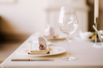 Table setting for a wedding ceremony at swimming pool. round table with white tablecloth