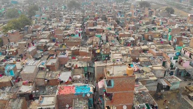 Indian slums in a situation of deteriorated, incomplete infrastructure, lacking in reliable sanitation services, supply of clean water & other basic services