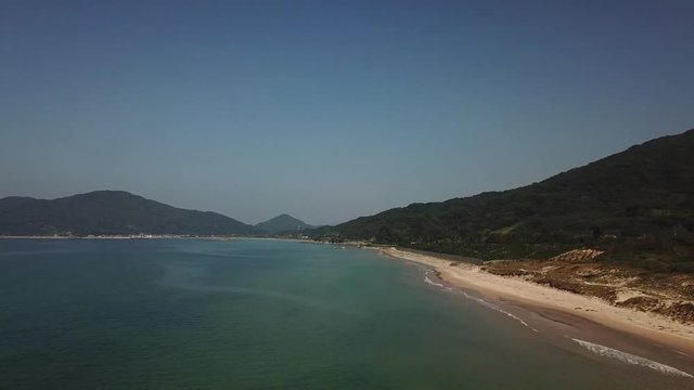 beach and blue ocean aerial footage with blue sky along the coast, nokita itoshima fukuoka japan v03