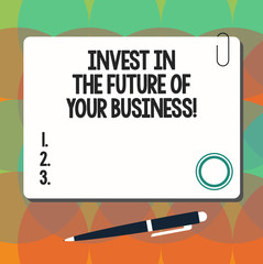 Conceptual hand writing showing Invest In The Future Of Your Business. Business photo showcasing Make investments to improve company Square Color Board with Magnet Click Ballpoint Pen and Clip